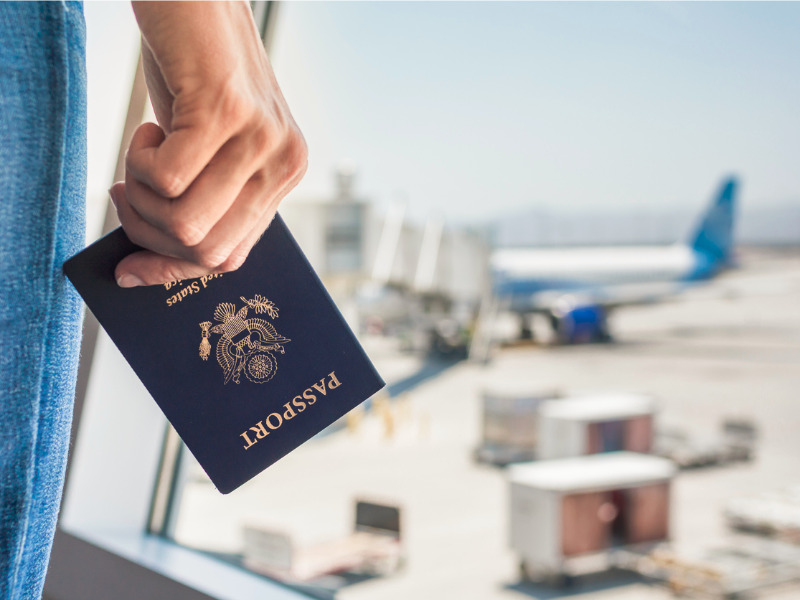 Woman at the airport with Canadian passport