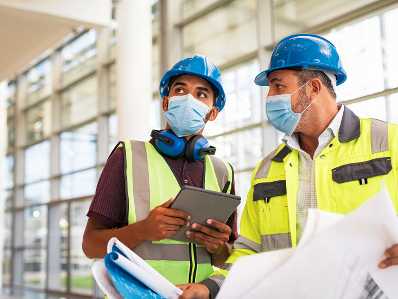 Architect and engineer talking on a construction site