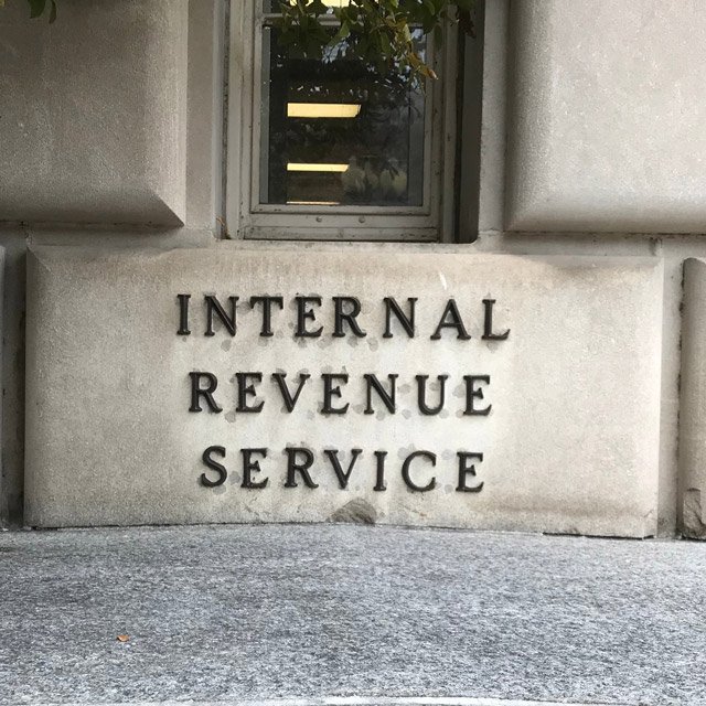 A concrete block in the wall of the IRS building that says,