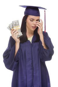stockfresh_3576539_stressed-female-graduate-holding-stacks-of-hundred-dollar-bills_sizeS-200x300