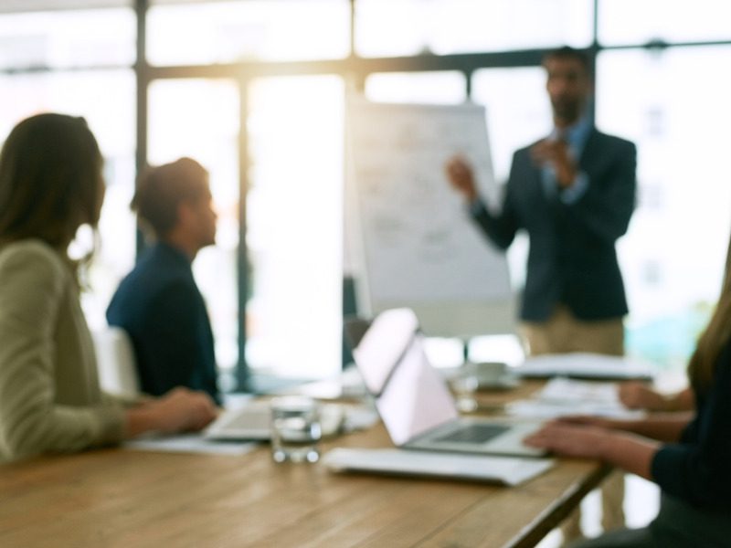 Stakeholders conducting a strategic planning review in the boardroom