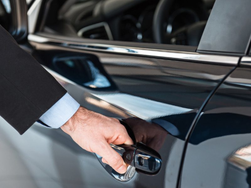 Man getting into a rental vehicle