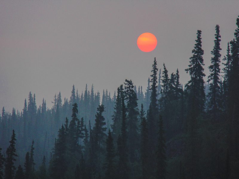 Midnight sun shines through forest fire smoke in Great Slave Lake, NWT