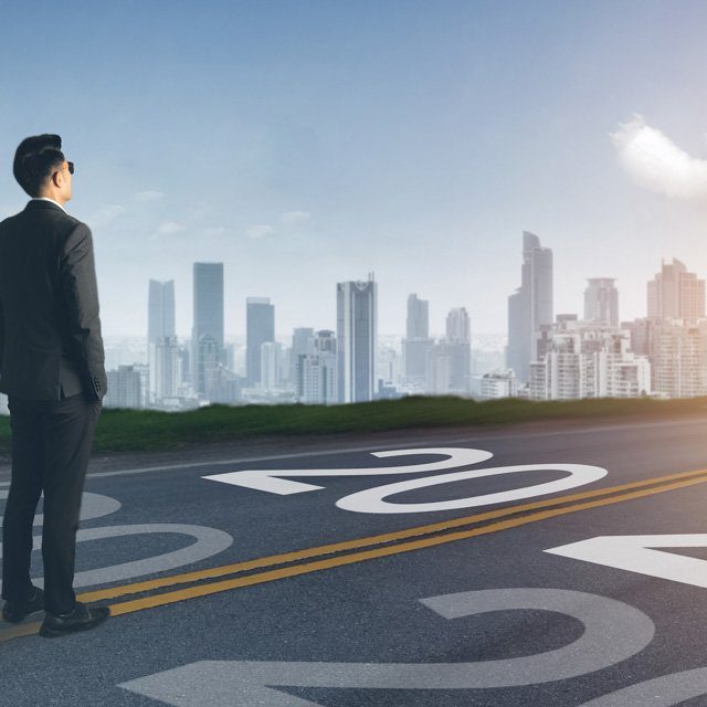 A man looking ahead at a city in the 2020s. (Credit: EPStudio20/Shutterstock.com)