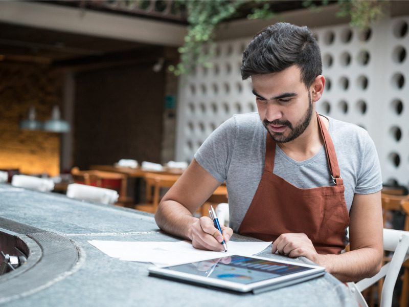 Businessman doing the books at a small business