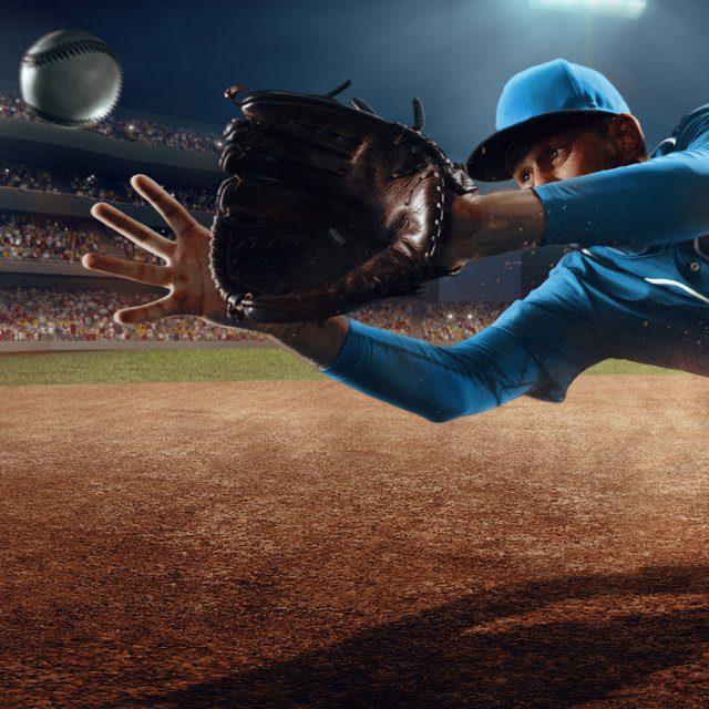 Adobe stock image of baseball player catching pitch