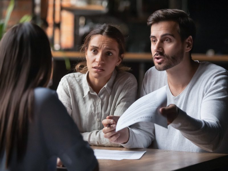 Angry couple arguing about bad contract