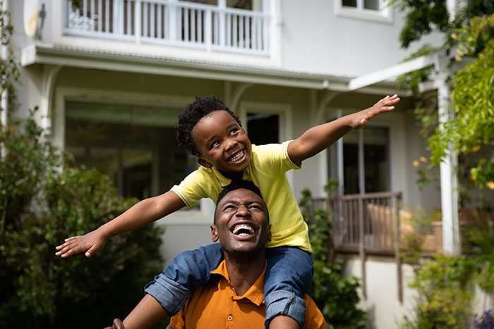 Father and son playing outside together