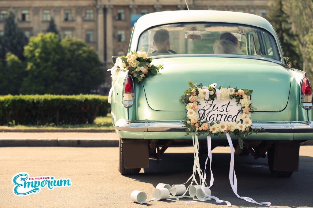 Wedding car driving off with the Bride and Groom  in the front