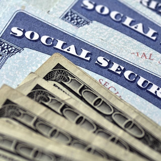 Social Security cards with money