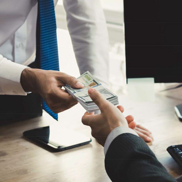 Businessman giving someone money