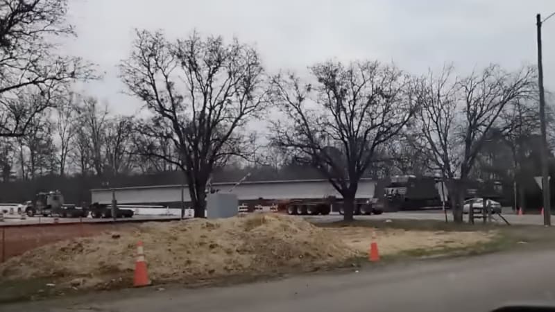 Video catches train derailment after striking truck hauling concrete beam