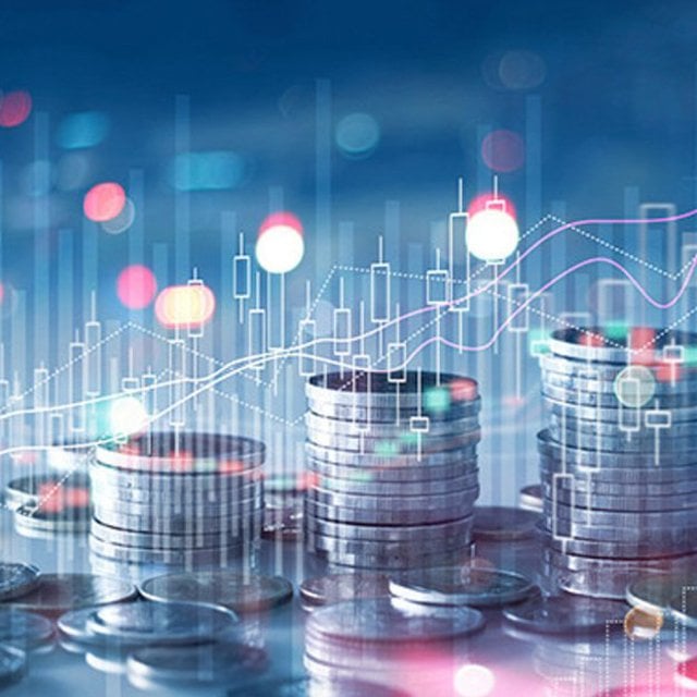 Financial stock market graph and rows of coins