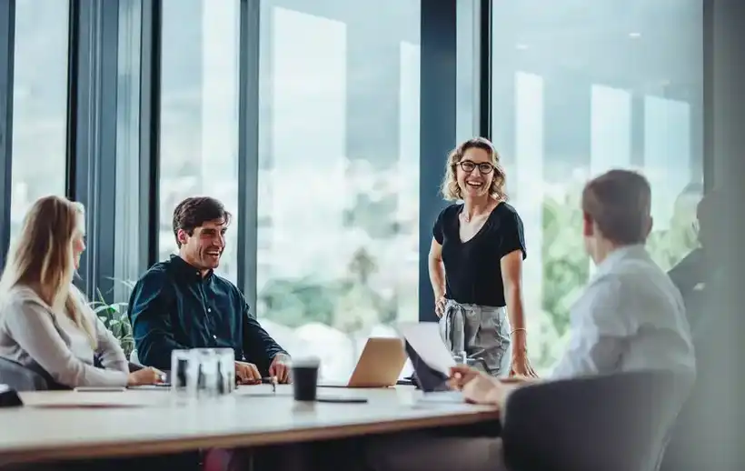 business corporate group together sat around desk