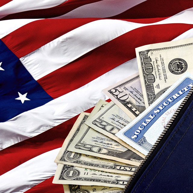 Social Security Card and money on an American Flag
