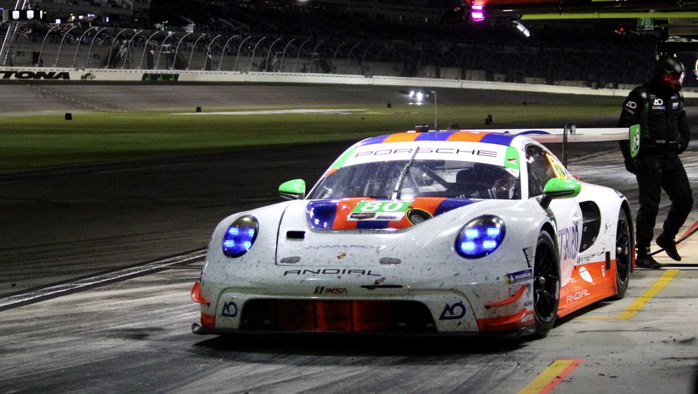 A Porsche 911 GTD car in the pit lane a porsche 911 gtd car in the pit lane