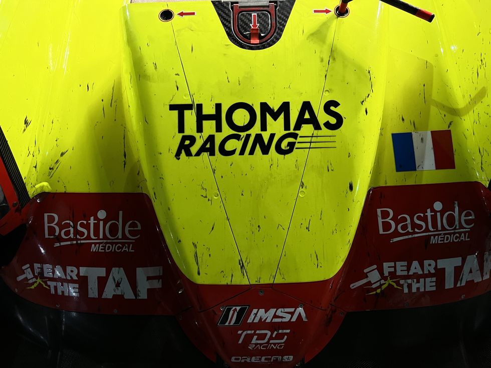 A well-worn race car. a well worn race car