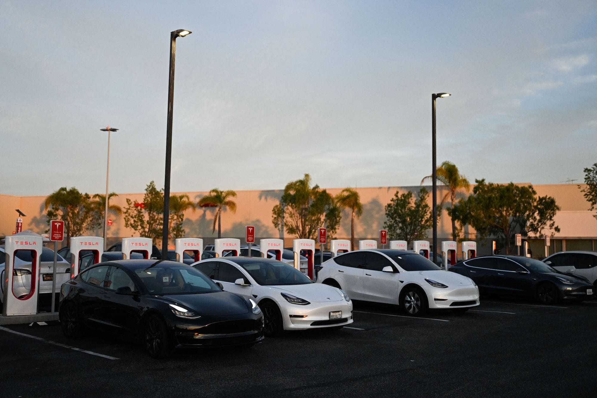 Tesla, Inc. electric vehicles charge at supercharger location in Hawthorne, California, on August 9, 2022.