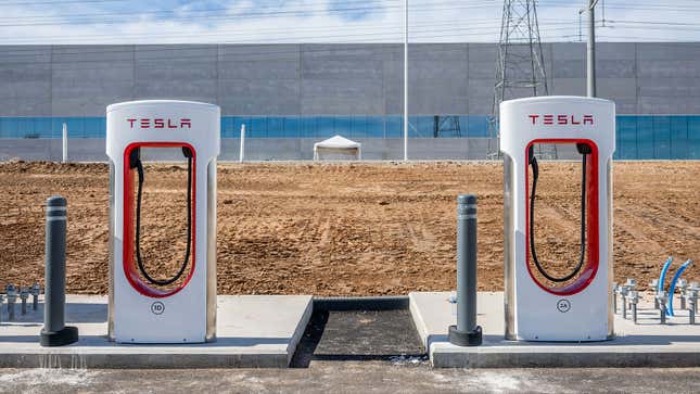 A photo of two Tesla superchargers. 