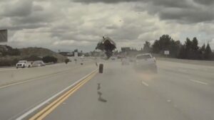 Runaway Truck Wheel Sends Kia Soul Flying off the Highway