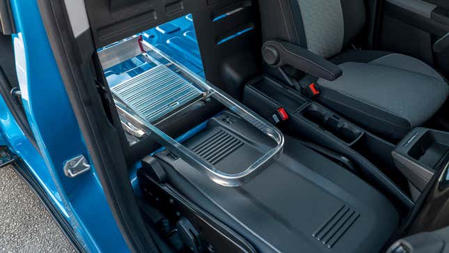 A photo of a ladder poking through a hatch in the Transit.