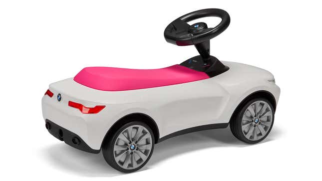 A photo of a pink and white BMW Baby Racer.