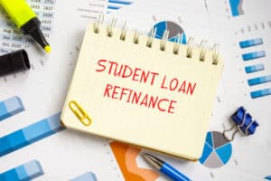 Student Loan Refinance phrase written on red on a sheet of yellow paper