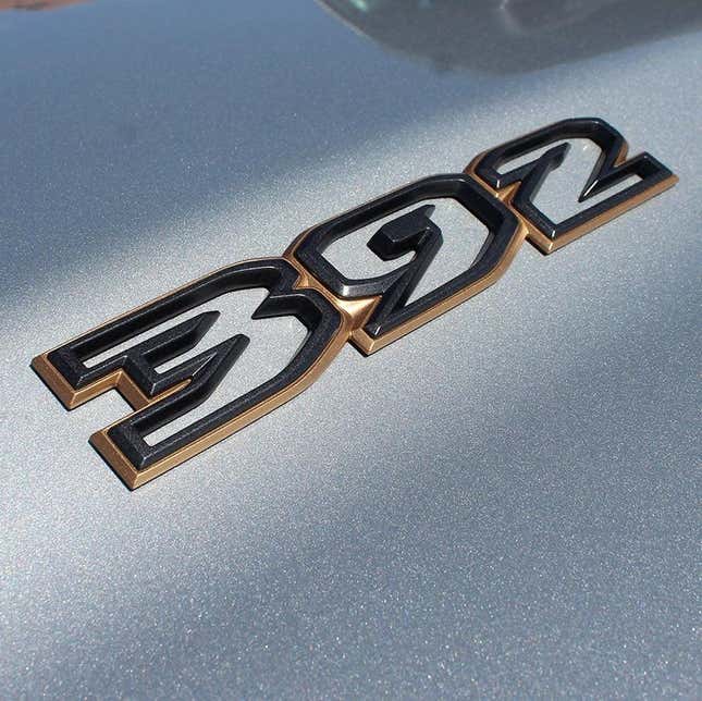 a photo of the 392 badge on a silver Jeep Wrangler.