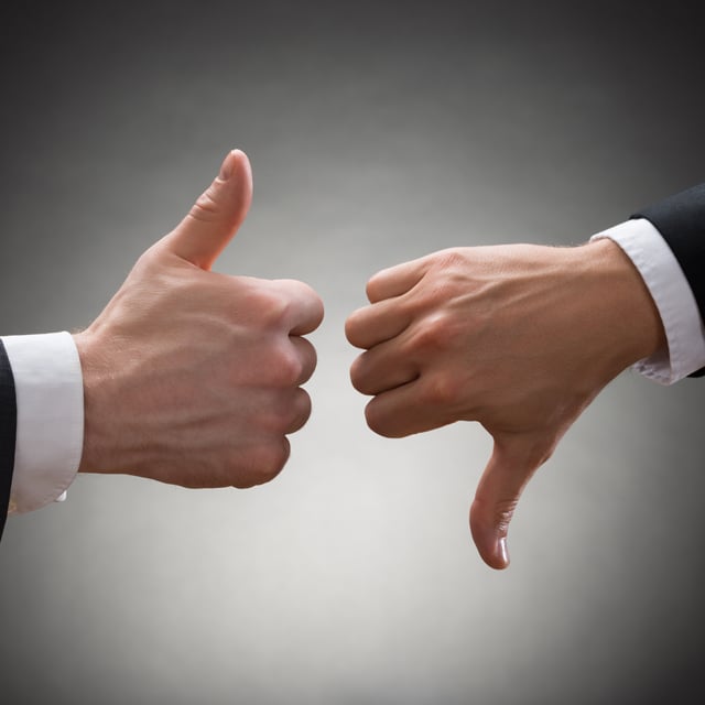 Businesspeople Hands Showing Thumb Up And Thumb Down