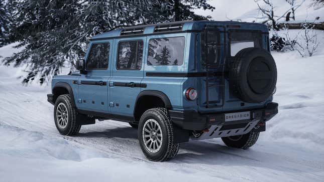 A photo of a blue Ineos Grenadier SUV on snow.