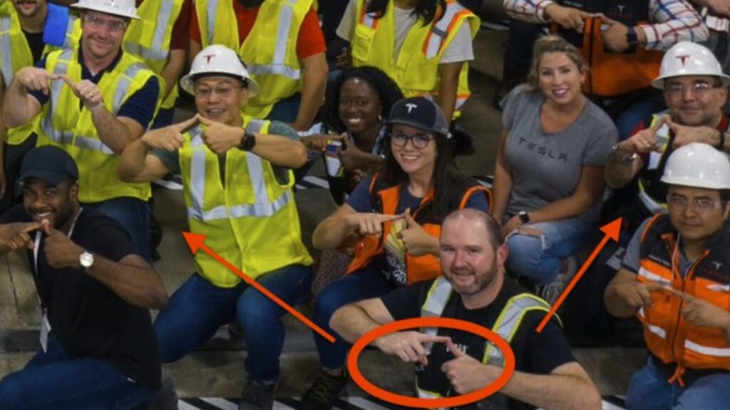 Look closely: Tesla workers flash a Cybertruck hand signal