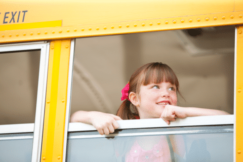 School Bus: Little Girl Looking Forward To School