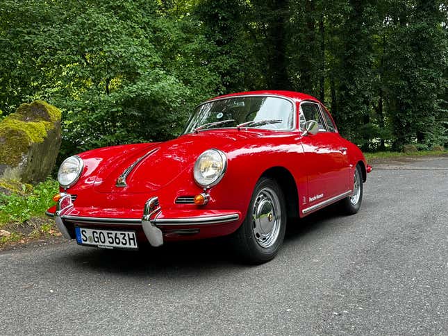 A red 1963 Porsche 356 Super 90 Coupe is parked in the Black Forest, front three-quarter view