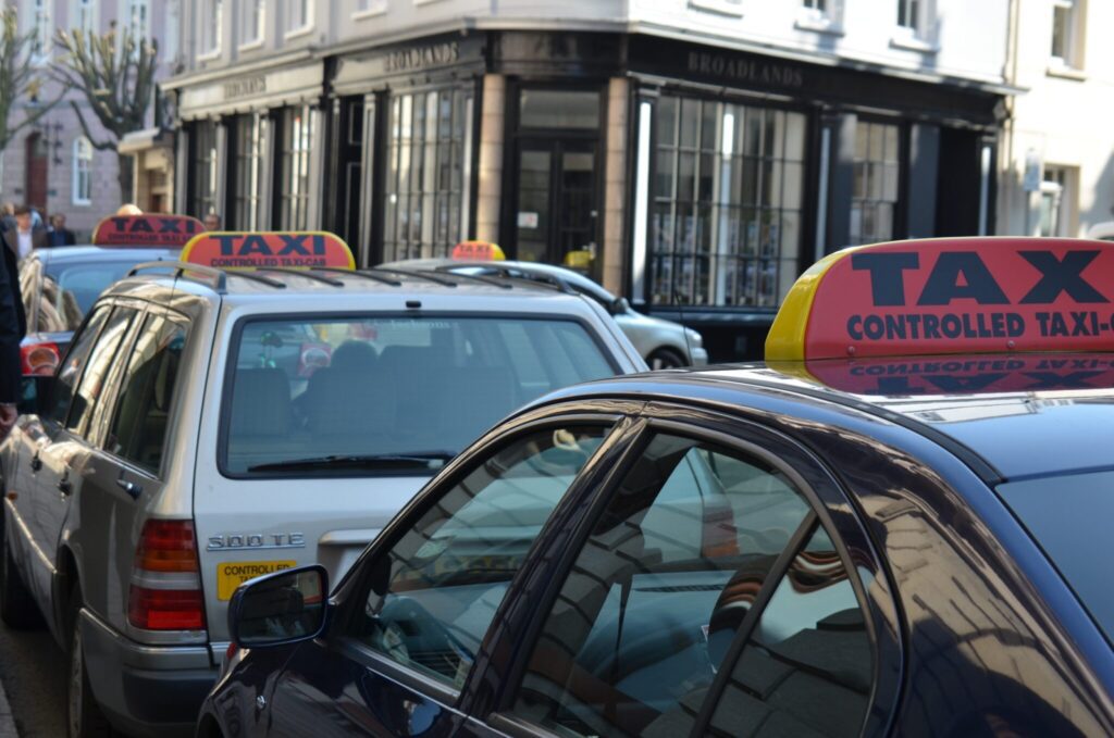 A queue of taxis with Taxi Insurance waiting for a fare