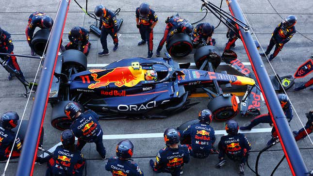 A photo of a Red Bull F1 car in the pits. 