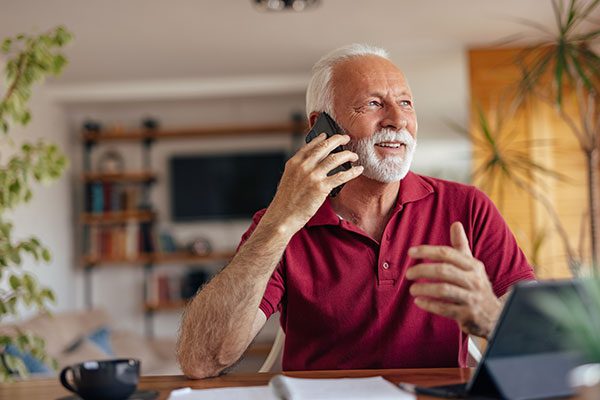 Senior man on the phone with his agent asking, ‘What does LIRP mean?’