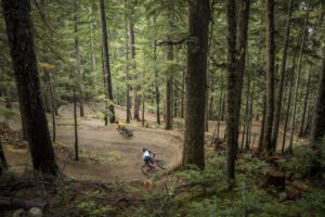 Mountain bikers riding a trail in the Whistler bike park