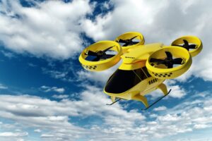 yellow flying taxi with a cloudy blue sky background