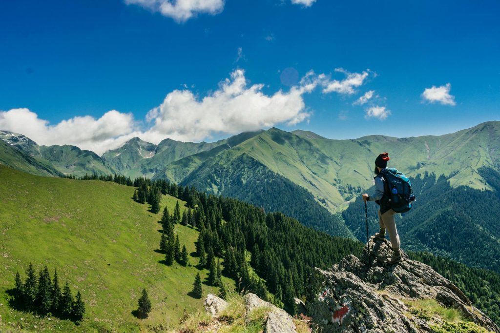 Man standing on a mountain stress-free