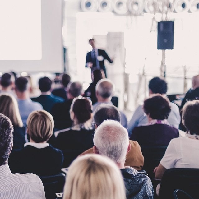 A speaker giving a presentation